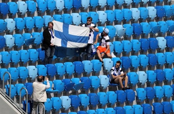 Finland fans display a flag as they wait in their seats prior to the UEFA Euro 2020 Championship Group B match between Finland and Russia at Saint...