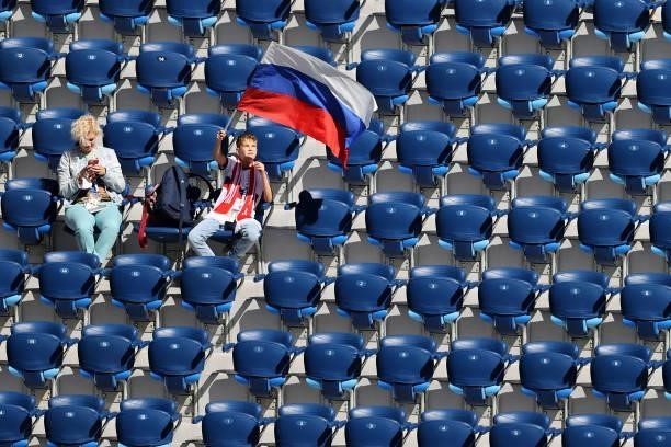 Russia fan waves a flag inside the stadium prior to the UEFA Euro 2020 Championship Group B match between Finland and Russia at Saint Petersburg...
