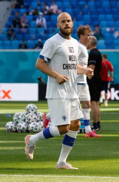 Teemu Pukki of Finland enters the pitch for the warm up wearing a 'Get well Christian Eriksen' shirt prior to the UEFA Euro 2020 Championship Group B...