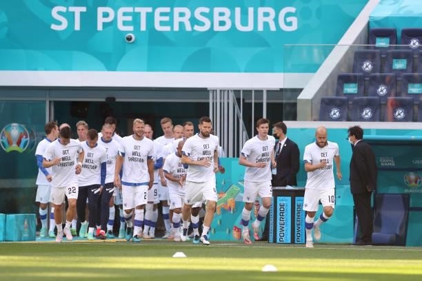 Teemu Pukki of Finland leads the team out for the warm up as the Finland team wear 'Get well Christian Eriksen' shirts prior to the UEFA Euro 2020...