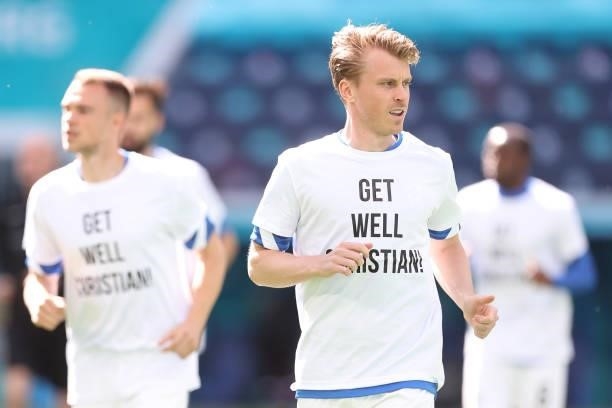Rasmus Schueller of Finland warms up wearing a 'Get well Christian Eriksen' shirt prior to the UEFA Euro 2020 Championship Group B match between...