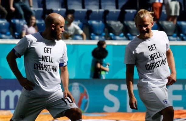 Joel Pohjanpalo and Teemu Pukki of Finland warm up wearing 'Get well Christian Eriksen' shirts prior to the UEFA Euro 2020 Championship Group B match...