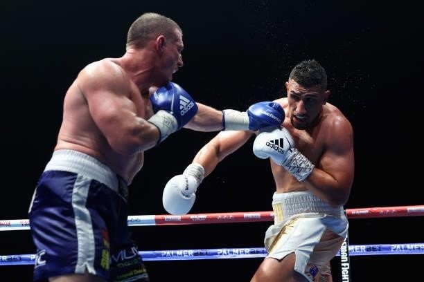 Paul Gallen punches Justis Huni during their Australian heavyweight title fight at ICC Sydney on June 16, 2021 in Sydney, Australia.