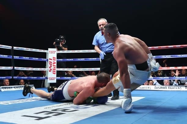 Paul Gallen tackles Justis Huni during their Australian heavyweight title fight at ICC Sydney on June 16, 2021 in Sydney, Australia.