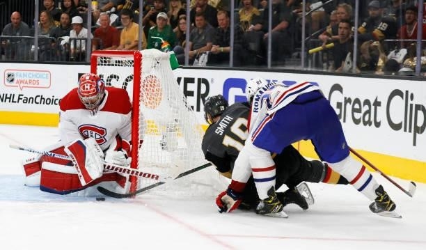 Carey Price of the Montreal Canadiens makes a save against Reilly Smith of the Vegas Golden Knights as Alexander Romanov of the Canadiens defends...