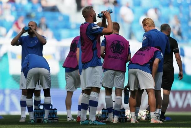 Paulus Arajuuri of Finland takes a drink as he warms up with team mates prior to the UEFA Euro 2020 Championship Group B match between Finland and...