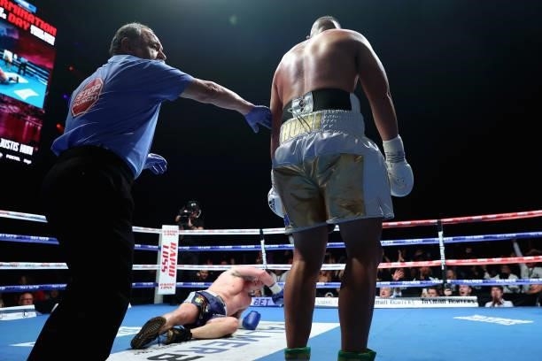 Justis Huni knocks Paul Gallen to the canvas during their Australian heavyweight title fight at ICC Sydney on June 16, 2021 in Sydney, Australia.