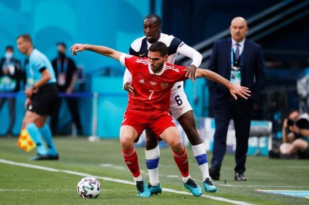 Magomed Ozdoev of Russia is closed down by Glen Kamara of Finland during the UEFA Euro 2020 Championship Group B match between Finland and Russia at...