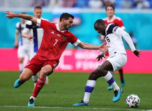 Magomed Ozdoev of Russia battles for possession with Glen Kamara of Finland during the UEFA Euro 2020 Championship Group B match between Finland and...