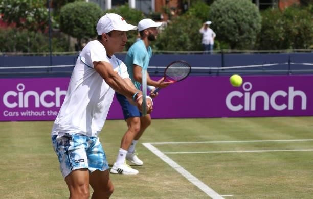 Ryan Peniston of Great Britain, playing partner of Liam Broady of Great Britain plays a forehand during there Round of 16 match against Pierre-Hugues...
