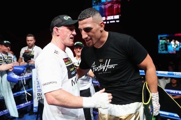 Justis Huni is congratulated by Paul Gallen after winning their Australian heavyweight title fight at ICC Sydney on June 16, 2021 in Sydney,...