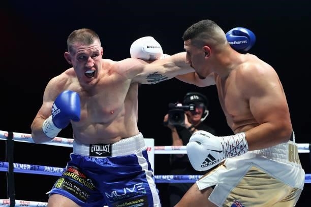 Paul Gallen punches Justis Huni during their Australian heavyweight title fight at ICC Sydney on June 16, 2021 in Sydney, Australia.