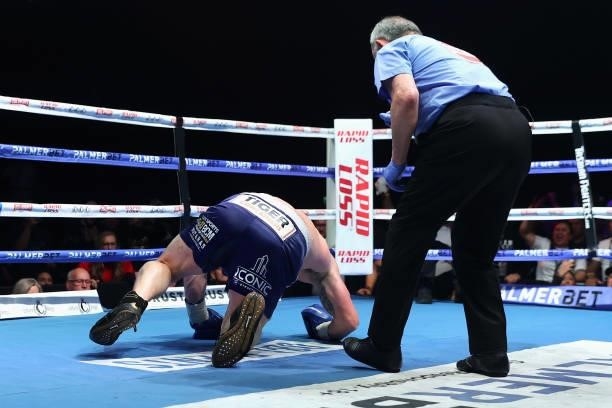 Justis Huni knocks Paul Gallen to the canvas during their Australian heavyweight title fight at ICC Sydney on June 16, 2021 in Sydney, Australia.