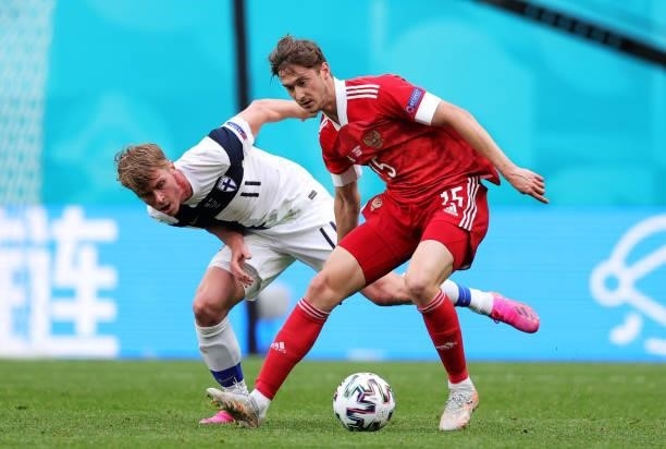 Rasmus Schueller of Finland battles for possession with Aleksei Miranchuk of Russia during the UEFA Euro 2020 Championship Group B match between...