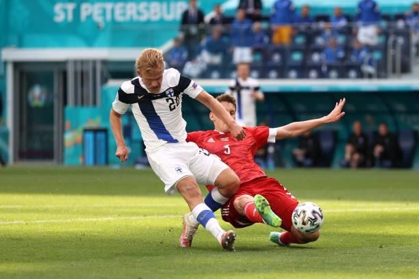 Joel Pohjanpalo of Finland is challenged by Igor Diveev of Russia during the UEFA Euro 2020 Championship Group B match between Finland and Russia at...