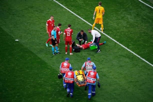 Mario Fernandes of Russia receives medical treatment before being stretchered off during the UEFA Euro 2020 Championship Group B match between...