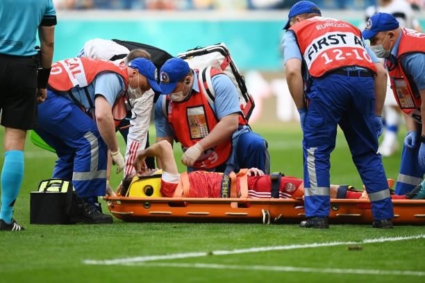 Mario Fernandes of Russia receives medical treatment as he is stretchered off during the UEFA Euro 2020 Championship Group B match between Finland...