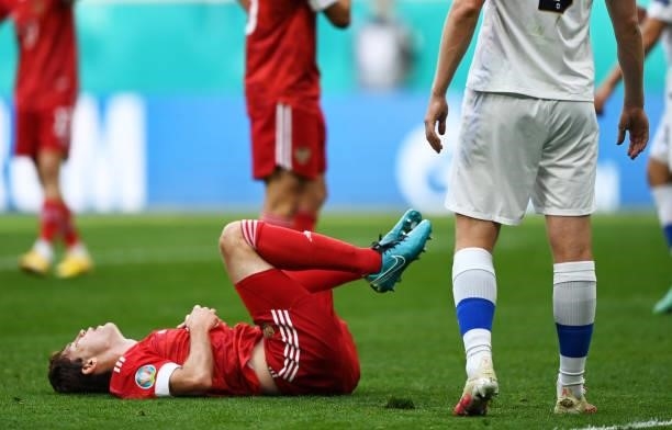 Mario Fernandes of Russia goes down injured during the UEFA Euro 2020 Championship Group B match between Finland and Russia at Saint Petersburg...