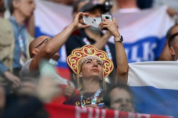 Fans take pictures during the UEFA Euro 2020 Championship Group B match between Finland and Russia at Saint Petersburg Stadium on June 16, 2021 in...
