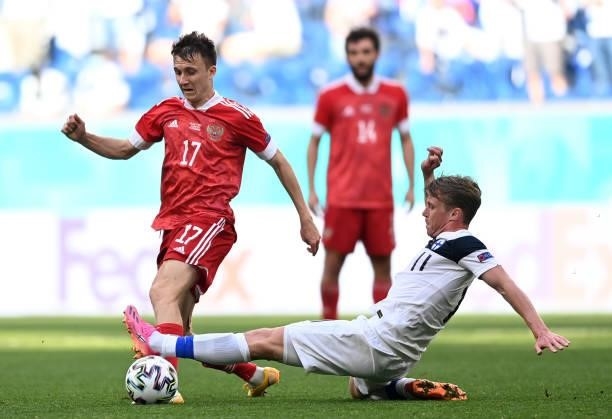 Aleksandr Golovin of Russia is challenged by Rasmus Schueller of Finland during the UEFA Euro 2020 Championship Group B match between Finland and...
