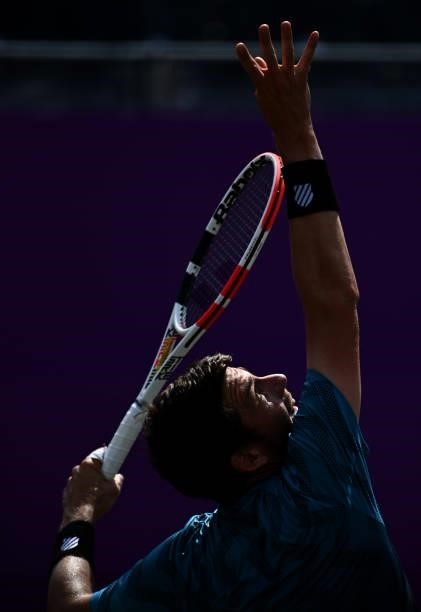 Cameron Norrie of Great Britain plays serves during his Round of 16 match against Aslan Karatsev of Russia during Day 3 of The cinch Championships at...