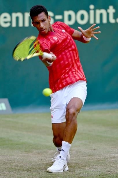 Felix Auger-Aliassime of Canada plays a forehand in his match against Roger Federer of Switzerland during day 5 of the Noventi Open at OWL-Arena on...