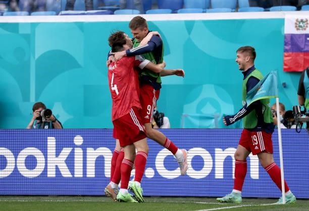 Aleksei Miranchuk of Russia celebrates with Vyacheslav Karavaev and Aleksandr Sobolev after scoring their side's first goal during the UEFA Euro 2020...