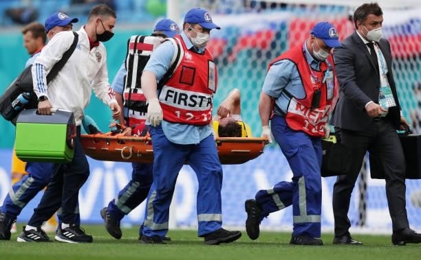 Mario Fernandes of Russia is stretchered off after suffering an injury during the UEFA Euro 2020 Championship Group B match between Finland and...