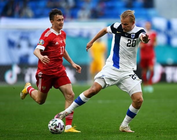 Joel Pohjanpalo of Finland is closed down by Aleksandr Golovin of Russia during the UEFA Euro 2020 Championship Group B match between Finland and...