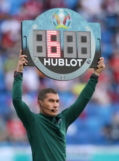 Fourth Official, Istvan Kovacs raises the substitute board displaying six minutes of added time at the end of the first half during the UEFA Euro...