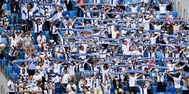 Finland fans raise scarves as they show their support during the UEFA Euro 2020 Championship Group B match between Finland and Russia at Saint...