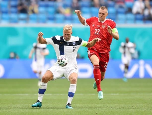 Paulus Arajuuri of Finland is closed down by Artem Dzyuba of Russia during the UEFA Euro 2020 Championship Group B match between Finland and Russia...