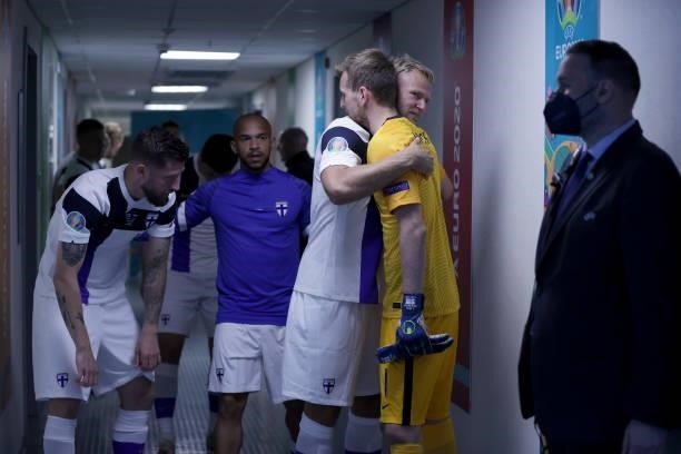 Paulus Arajuuri of Finland interacts with team mate Lukas Hradecky in the tunnel prior to the UEFA Euro 2020 Championship Group B match between...