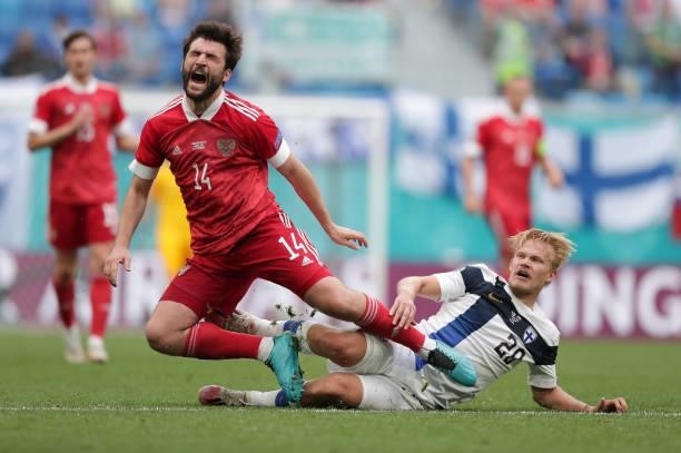 Georgi Dzhikiya of Russia is challenged by Joel Pohjanpalo of Finland during the UEFA Euro 2020 Championship Group B match between Finland and Russia...