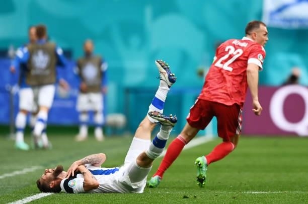 Joona Toivio of Finland reacts as he appears to be injured during the UEFA Euro 2020 Championship Group B match between Finland and Russia at Saint...