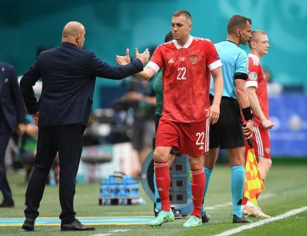 Artem Dzyuba of Russia shakes hands with Stanislav Cherchesov, Head Coach of Russia after being substituted during the UEFA Euro 2020 Championship...