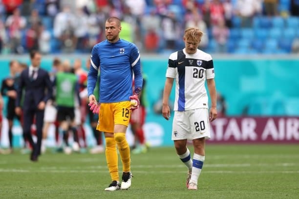 Jesse Joronen and Joel Pohjanpalo of Finland look dejected following defeat in the UEFA Euro 2020 Championship Group B match between Finland and...