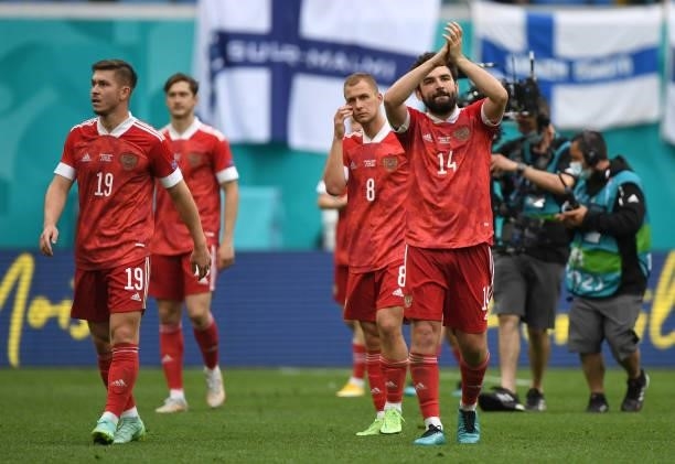 Rifat Zhemaletdinov, Dmitri Barinov and Georgi Dzhikiya of Russia applauds the fans after the UEFA Euro 2020 Championship Group B match between...