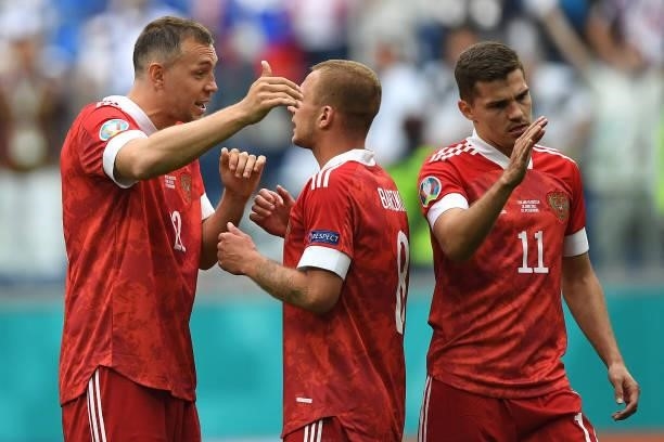 Artem Dzyuba, Dmitri Barinov and Roman Zobnin of Russia celebrates their side's victory after the UEFA Euro 2020 Championship Group B match between...