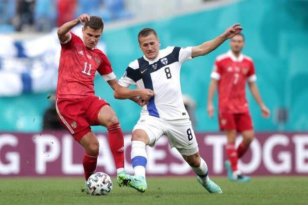 Roman Zobnin of Russia is closed down by Robin Lod of Finland during the UEFA Euro 2020 Championship Group B match between Finland and Russia at...