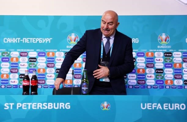 In this Handout picture provided by UEFA, Stanislav Cherchesov, Head Coach of Russia prepares to speak to the media during the Russia Press...