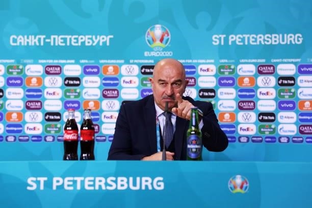 In this Handout picture provided by UEFA, Stanislav Cherchesov, Head Coach of Russia reacts as he speaks to the media during the Russia Press...