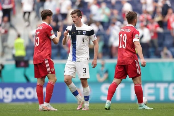 Daniel O'Shaughnessy of Finland interacts with Aleksei Miranchuk of Russia following the UEFA Euro 2020 Championship Group B match between Finland...