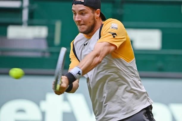 Jan-Lennard Struff of Germany plays a forehand in his match against Marcos Giron of the United States during day 5 of the Noventi Open at OWL-Arena...