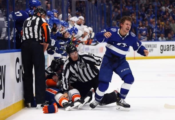 Yanni Gourde of the Tampa Bay Lightning battles with Leo Komarov of the New York Islanders in Game Two of the Stanley Cup Semifinals during the 2021...