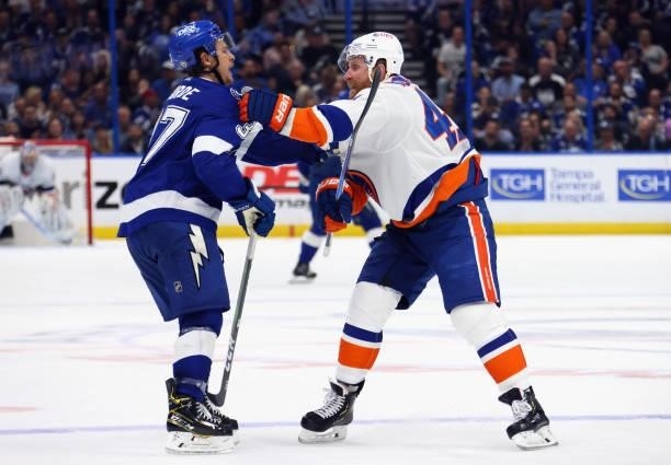 Yanni Gourde of the Tampa Bay Lightning battles with Leo Komarov of the New York Islanders in Game Two of the Stanley Cup Semifinals during the 2021...