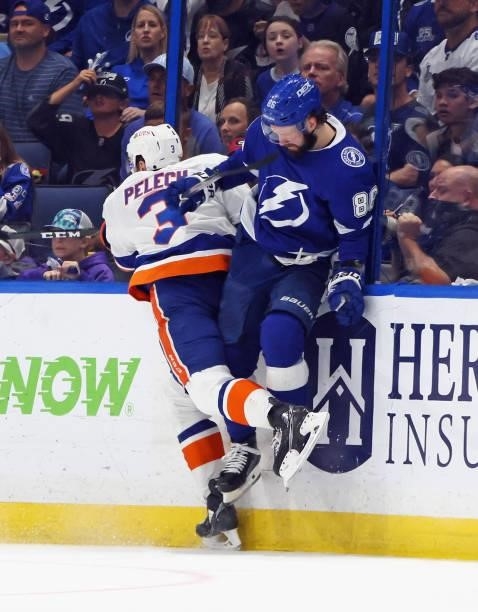 Nikita Kucherov of the Tampa Bay Lightning is checked by Adam Pelech of the New York Islanders in Game Two of the Stanley Cup Semifinals during the...