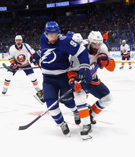 Tyler Johnson of the Tampa Bay Lightning and Kyle Palmieri of the New York Islanders battle for position in Game Two of the Stanley Cup Semifinals...
