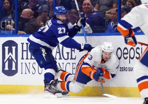 Mathew Barzal of the New York Islanders is checked by Ryan McDonagh of the Tampa Bay Lightning in Game Two of the Stanley Cup Semifinals during the...
