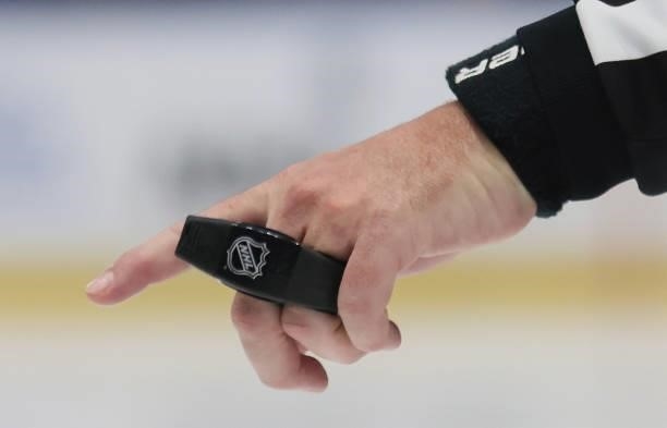 Linesman gets ready to drop the puck during the game between the Tampa Bay Lightning and the New York Islanders in Game Two of the Stanley Cup...